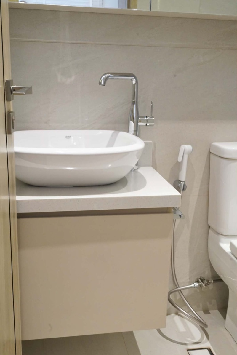 Wall-hung basin cabinet with a white vessel basin