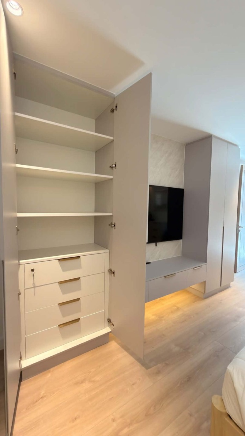 Open wardrobe with adjustable shelves, drawers and LED lighting